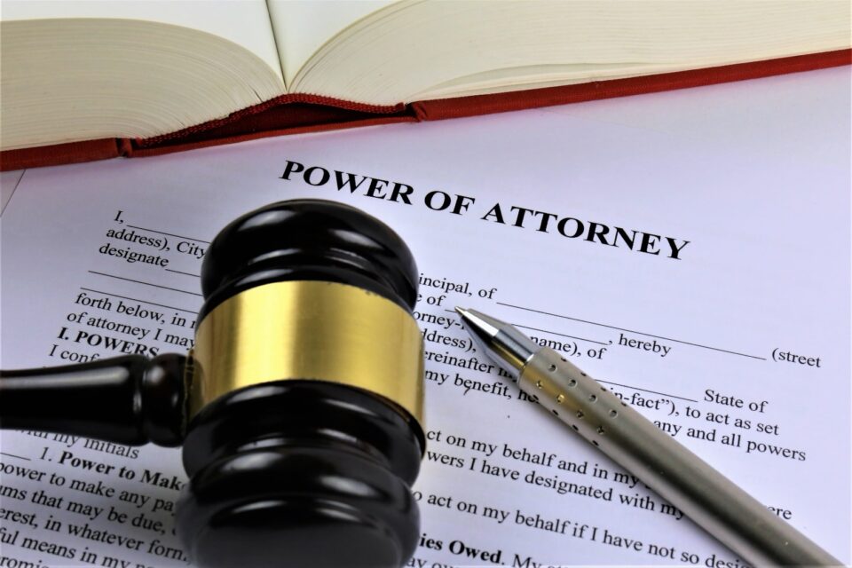 Power of Attorney document on a desk with a gavel