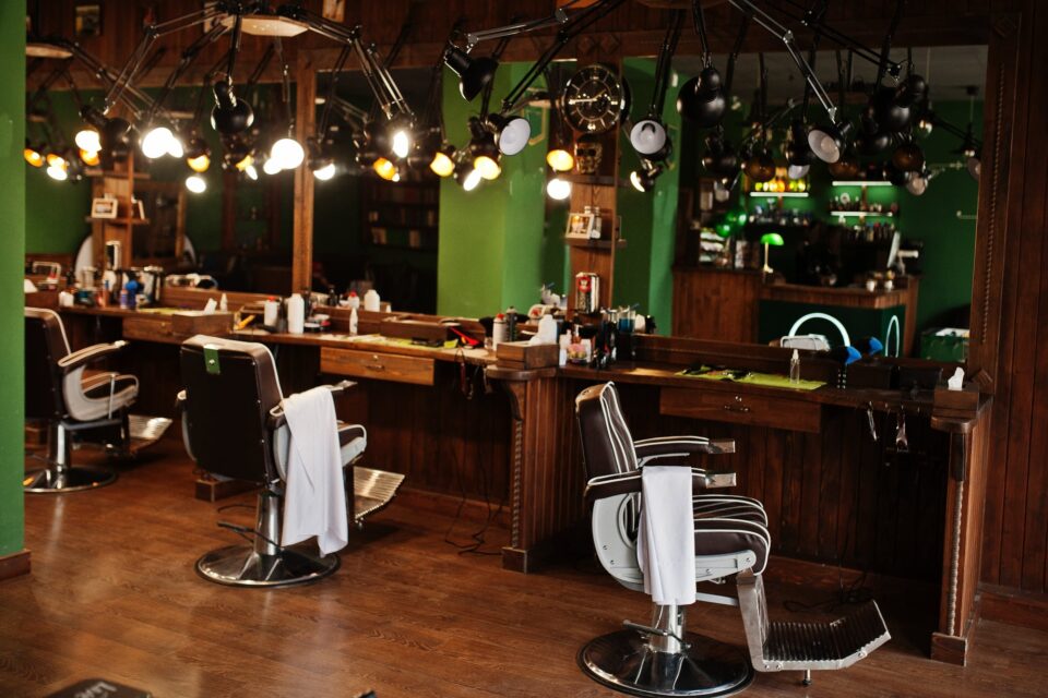 Empty barber chairs in a vintage-style barber shop